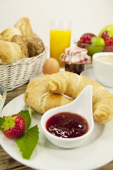 traditional french breakfast in morning on wooden background