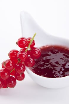 tasty fresh red currant jam isolated on white background