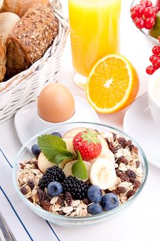 deliscious healthy breakfast with flakes and fruits isolated on white background