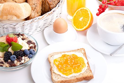 breakfast table with toast and orange marmelade isolated on white background