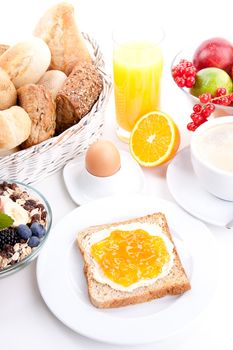 breakfast table with toast and orange marmelade isolated on white background