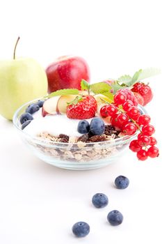deliscious healthy breakfast with flakes and fruits isolated on white background