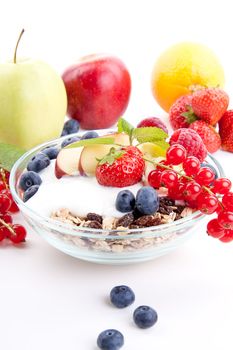 deliscious healthy breakfast with flakes and fruits isolated on white background