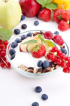 deliscious healthy breakfast with flakes and fruits isolated on white background