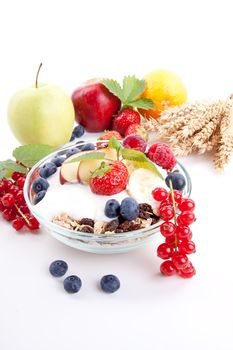 deliscious healthy breakfast with flakes and fruits isolated on white background