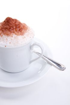 fresh capuccino with chocolate and milk foam isolated on white background