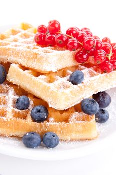 sweet fresh tasty waffles with mixed fruits isolated on white background