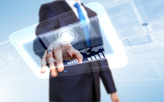 Businessman in blue suit working with digital vurtual screen