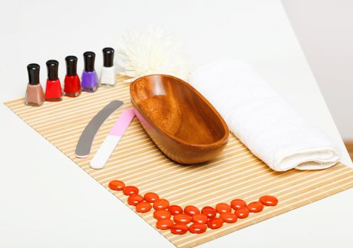 Young woman is getting manicure in a beauty salon