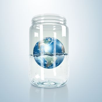 Image of our planet earth inside a glass jar