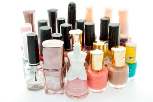 Many nail bottle of polish on white background isolate