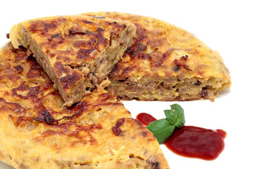 tortilla of minced meat with onion and zucchini on a white background