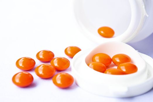 pills an pill bottle on white background