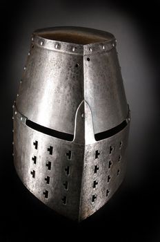 Iron helmet of the medieval knight. Very heavy headdress