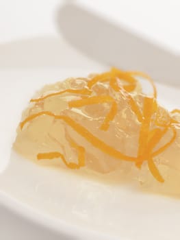 close up of a plate of orange marmalade