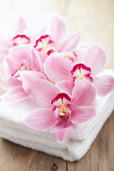 orchid flowers and towels for spa