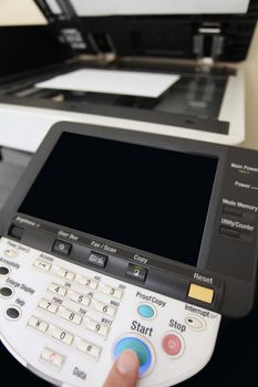 details Finger pressing of keyboard buttons of the laser copier