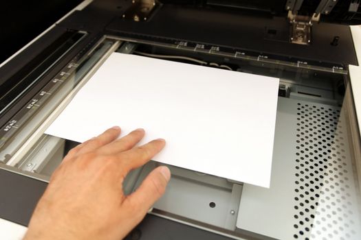 A person handling with working laser copier  