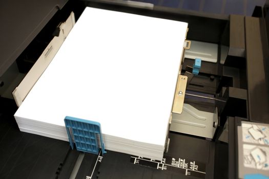 details of inserts a paper A4 into a laser copier