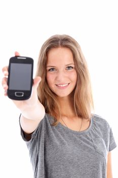 Pretty friendly smiling teenager holding up a mobile phone in her hand with the blank screen facing the camera Pretty friendly smiling teenager holding up a mobile phone in her hand with the blank screenfacing the camera 