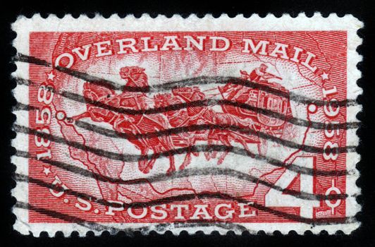 UNITED STATES OF AMERICA - CIRCA 1958: A stamp printed in USA ,   shows horse carriage postage , celebrating 100 years of overland mail circa 1958