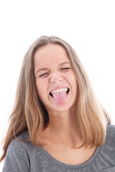 Playful girl sticking out her tongue in provocative mischief or because she has a horrible taste in her mouth 