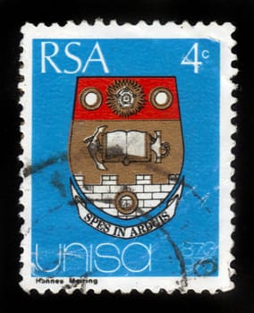 REPUBLIC OF SOUTH AFRICA - CIRCA 1973: A stamp printed in Republic of South Africa shows coat of arms of the university of the South Africa (Unisa), dedicated to the centenary, circa 1973
