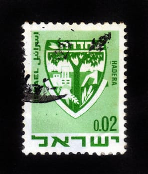ISRAEL - CIRCA 1960: A stamp printed in Israel, shows coat of arms of Hadera, Israel, series, circa 1960