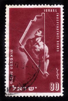ISRAEL - CIRCA 1951: stamp printed in Israel, shows an Israeli  worker  and a shape of the map of Israel , dedicated to Independence Bonds , circa 1951