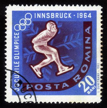 ROMANIA - CIRCA 1963: A stamp printed in Romania shows a competition of skaters on a Olympic Games in Innsbruck, Austria, circa 1963