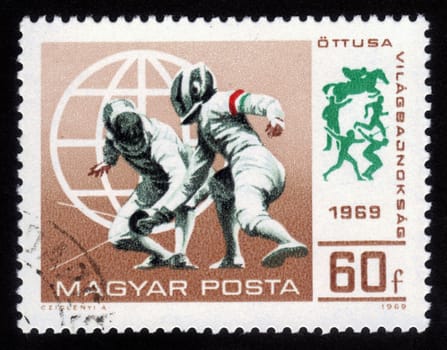 Hungary - CIRCA 1969: A stamp printed in Hungary shows a fencing competitions, circa 1969