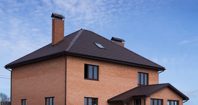 Roof tiles in a brick house and outbuilding
