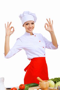 Young cook preparing food wearing a red apron