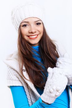 Young pretty woman in warm winter hat and scarf