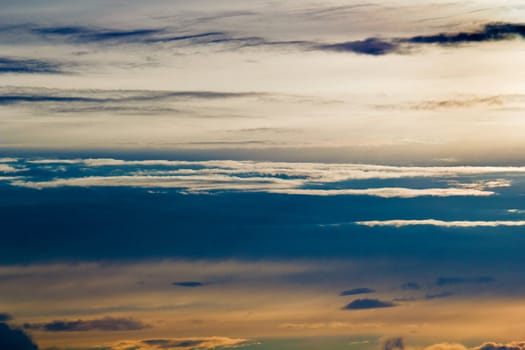 Amazing nature background: dramatic and moody blue cloudy sunset sky