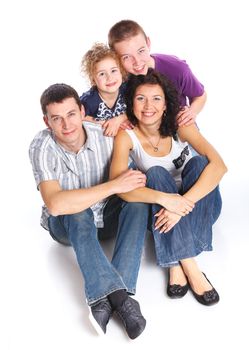 Portrait of happy Caucasian family smiling together on white background