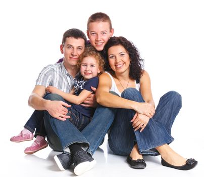 Portrait of happy Caucasian family smiling together on white background