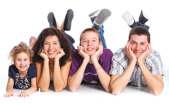 Portrait of happy Caucasian family smiling together on white background