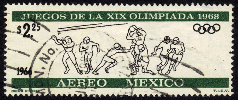 Mexico - CIRCA 1966: a stamp printed by Mexico shows rugby players.Olympic Games in Mexico 1968, circa 1966