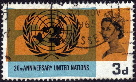 United Kingdom-CIRCA 1965: stamp printed in the United Kingdom, shows images of Queen Elizabeth II and the symbol of united nations, dedicated to 20th anniversary united nations, series, circa 1965