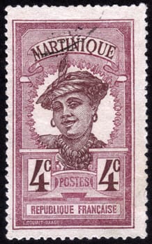 FRANCE - CIRCA 1923: stamp printed in the French colony of Martinique, shows images of woman in traditional head dress, Martinique, series, circa 1923