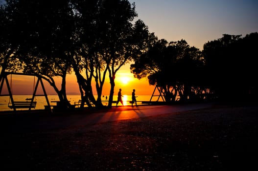 Sunset at the beach with people