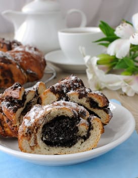 Slice poppy roll on the tea table