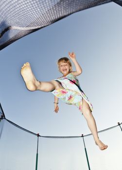 Young Girl Jumping in a trampoline