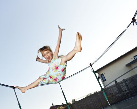 Young Girl Jumping in a trampoline
