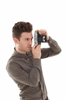 A young adult male on white background with an old film camera