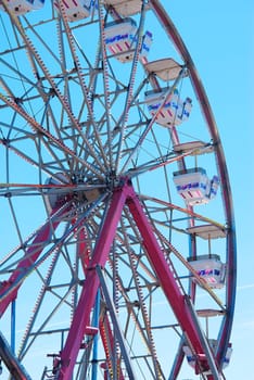 A brightly colored Ferris Wheel during the daytime