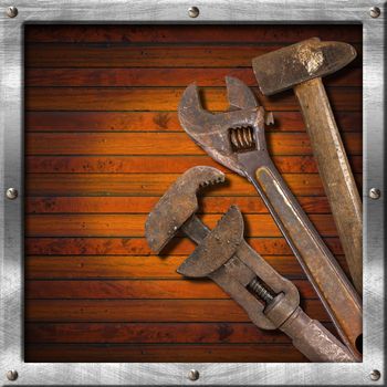 Wood and metal vintage background with old tools and space for text

