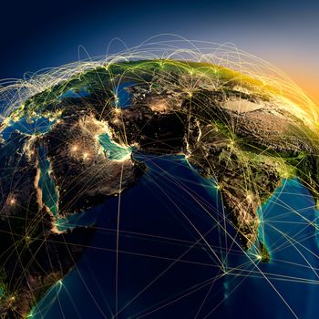 Highly detailed planet Earth at night with embossed continents, illuminated by light of cities, translucent and reflective ocean. Earth is surrounded by a luminous network, representing the major air routes based on real data