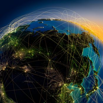 Highly detailed planet Earth at night with embossed continents, illuminated by light of cities, translucent and reflective ocean. Earth is surrounded by a luminous network, representing the major air routes based on real data